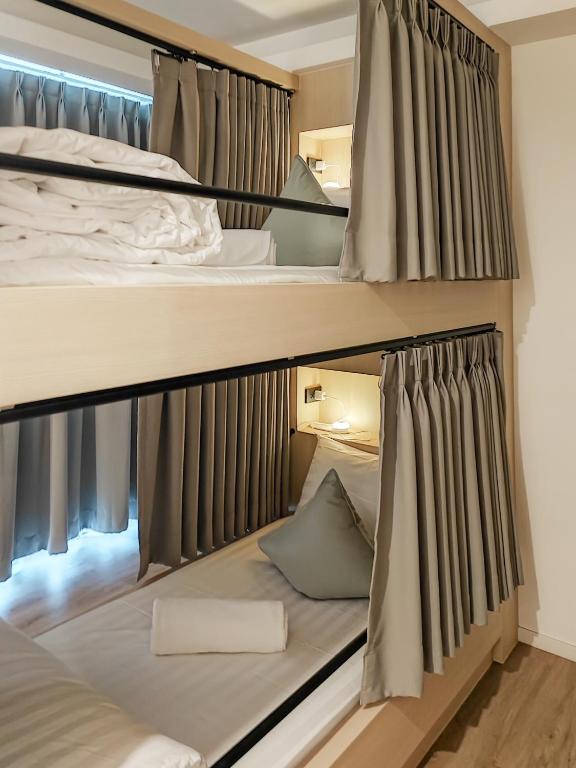 Postel nebo postele na pokoji v ubytování YAA Hostel