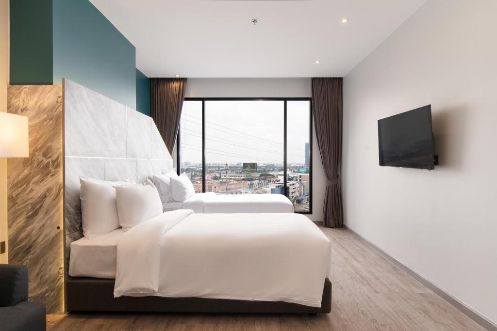 TV a/nebo společenská místnost v ubytování Thaya Hotel Bangkok
