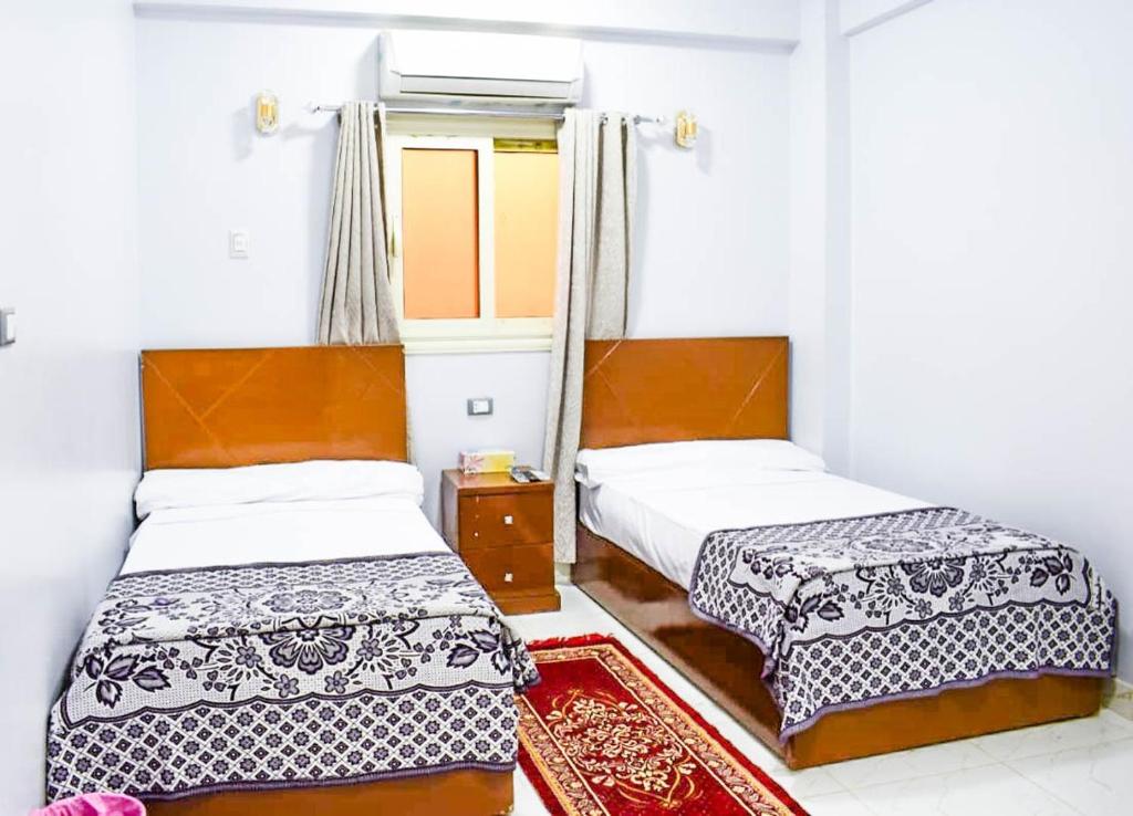 Postel nebo postele na pokoji v ubytování Niber Guest House
