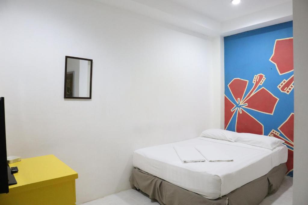 Postel nebo postele na pokoji v ubytování Island Inn