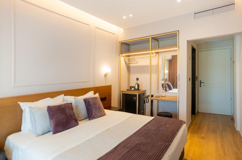 Posteľ alebo postele v izbe v ubytovaní Aggelos Hotel