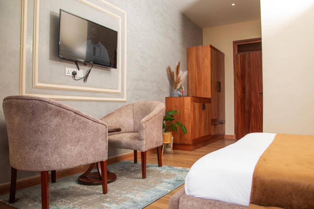 TV a/nebo společenská místnost v ubytování Flamarc Hotel