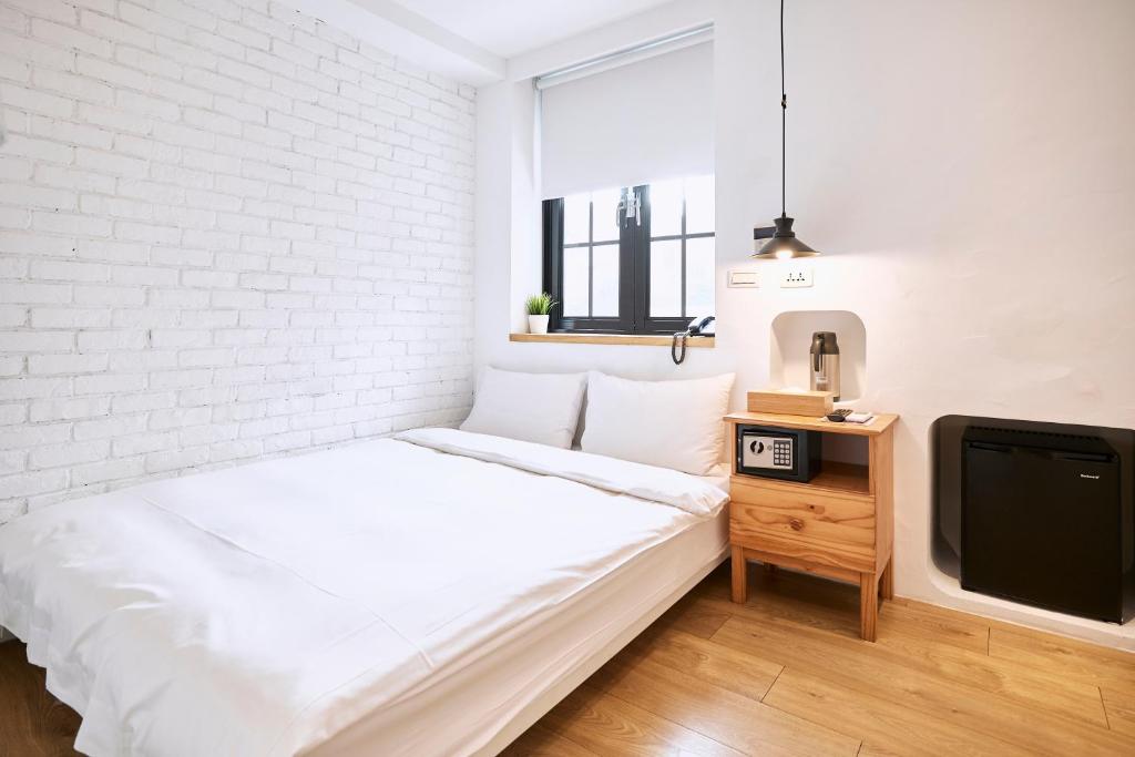 Postel nebo postele na pokoji v ubytování York Hotel