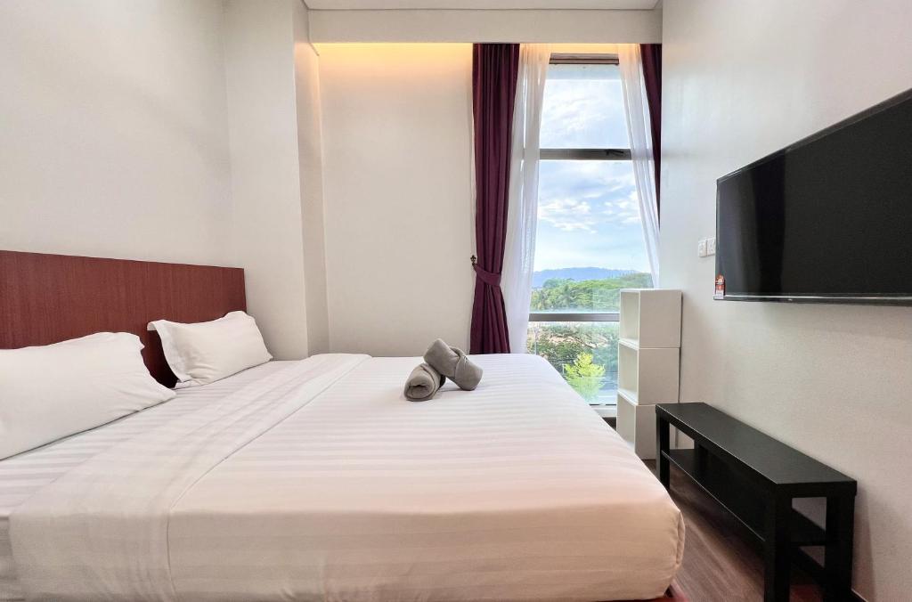 TV a/nebo společenská místnost v ubytování Margo Hotel Kota Kinabalu