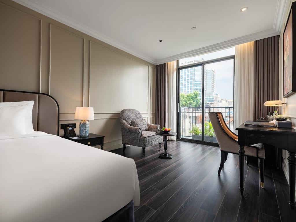 Postel nebo postele na pokoji v ubytování T Boutique Hotel