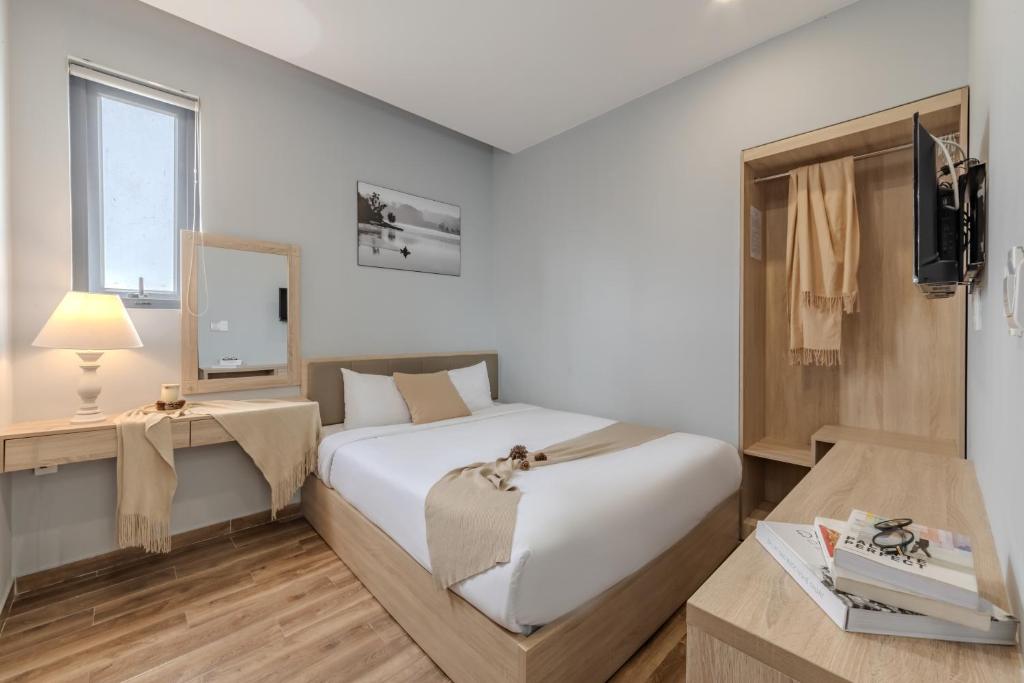 Giường trong phòng chung tại Gia Nguyễn Hotel Dalat