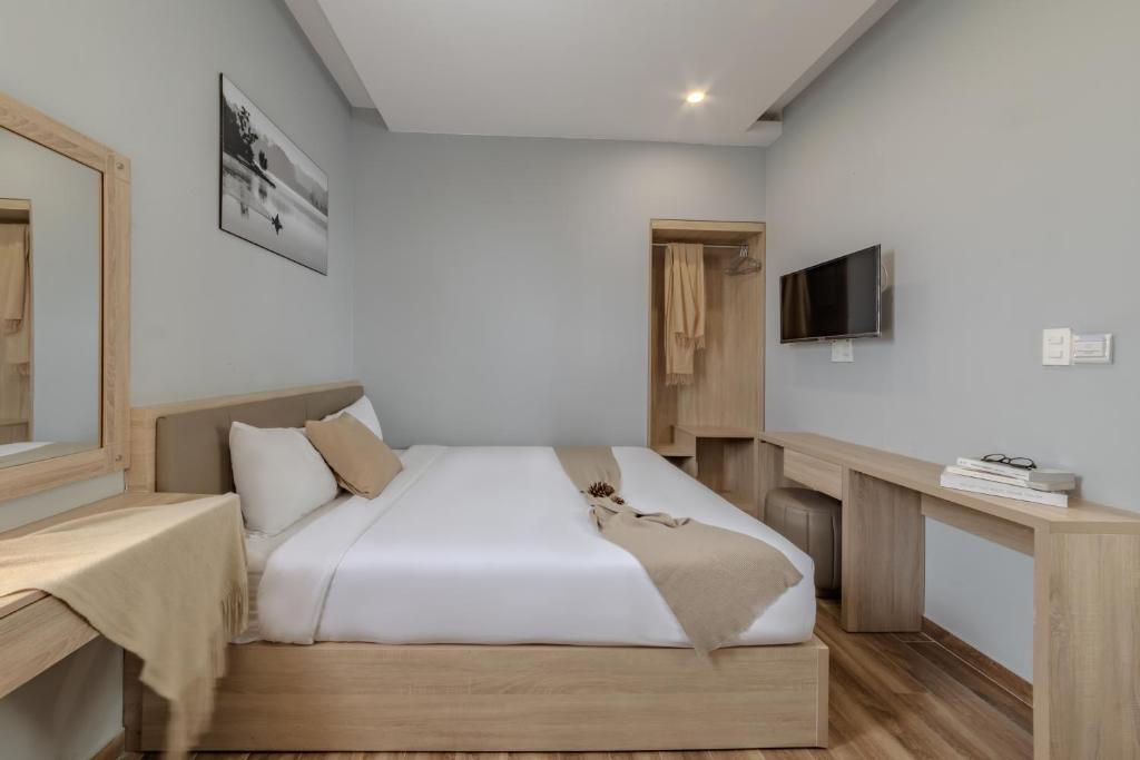 Giường trong phòng chung tại Gia Nguyễn Hotel Dalat