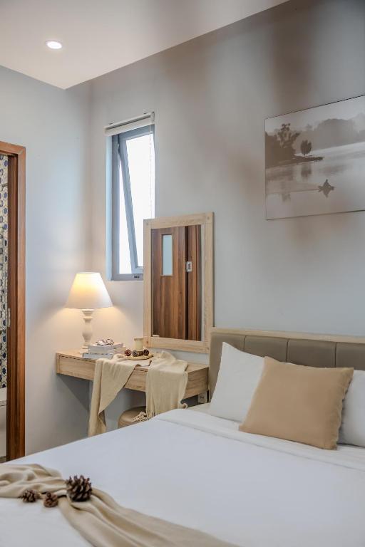Giường trong phòng chung tại Gia Nguyễn Hotel Dalat