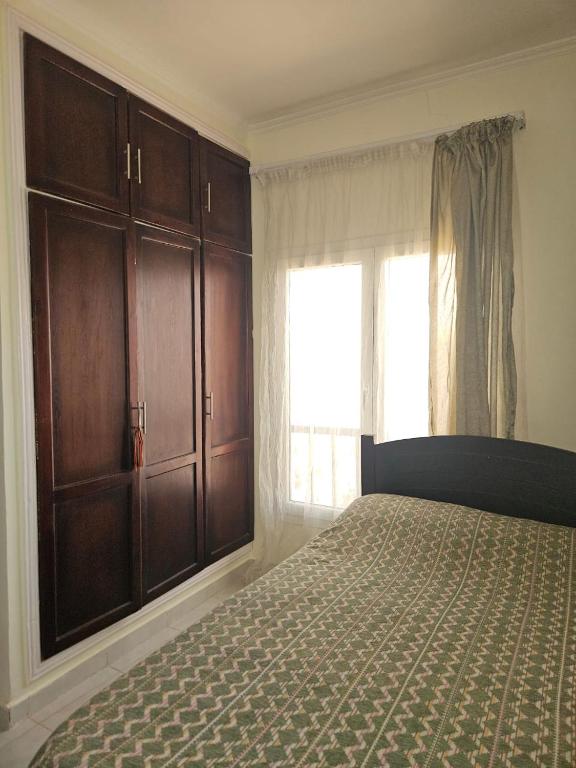 Postel nebo postele na pokoji v ubytování Hurghada Village sea view