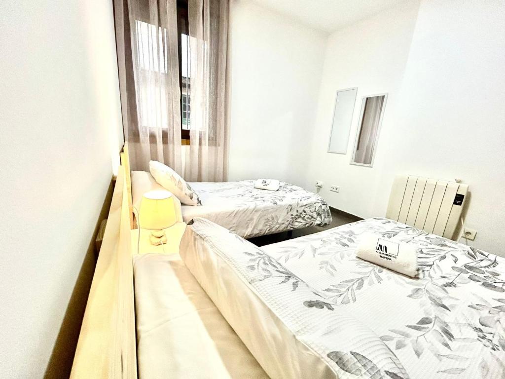 A bed or beds in a room at O LAR DE MARTINA