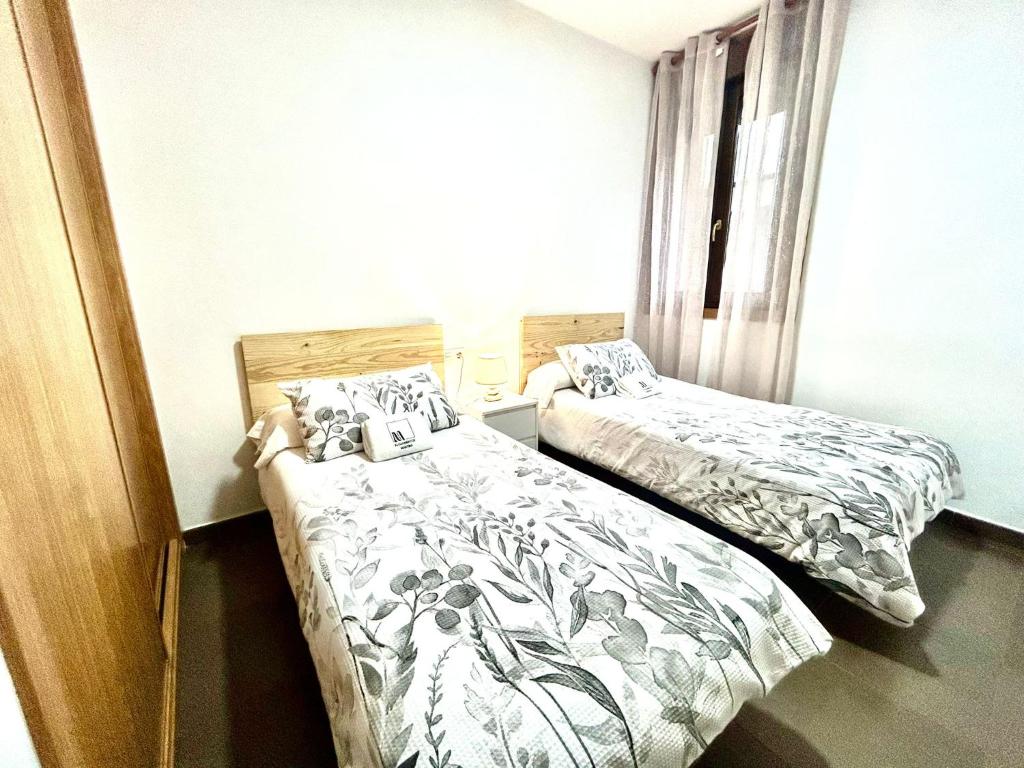 A bed or beds in a room at O LAR DE MARTINA