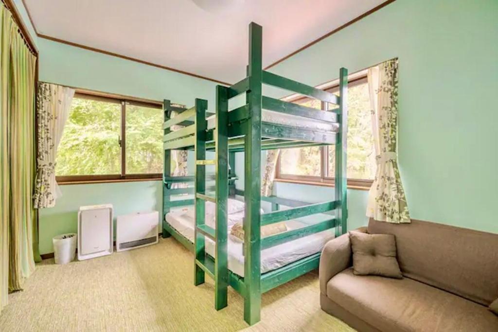 Postel nebo postele na pokoji v ubytování Guesthouse Murabito