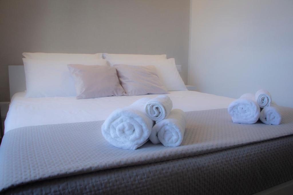 a bed with towels on top of it at Il Piccolo Attico comfort house in Viterbo