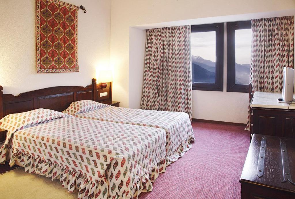 Postel nebo postele na pokoji v ubytování HOTEL SPA MONTANA