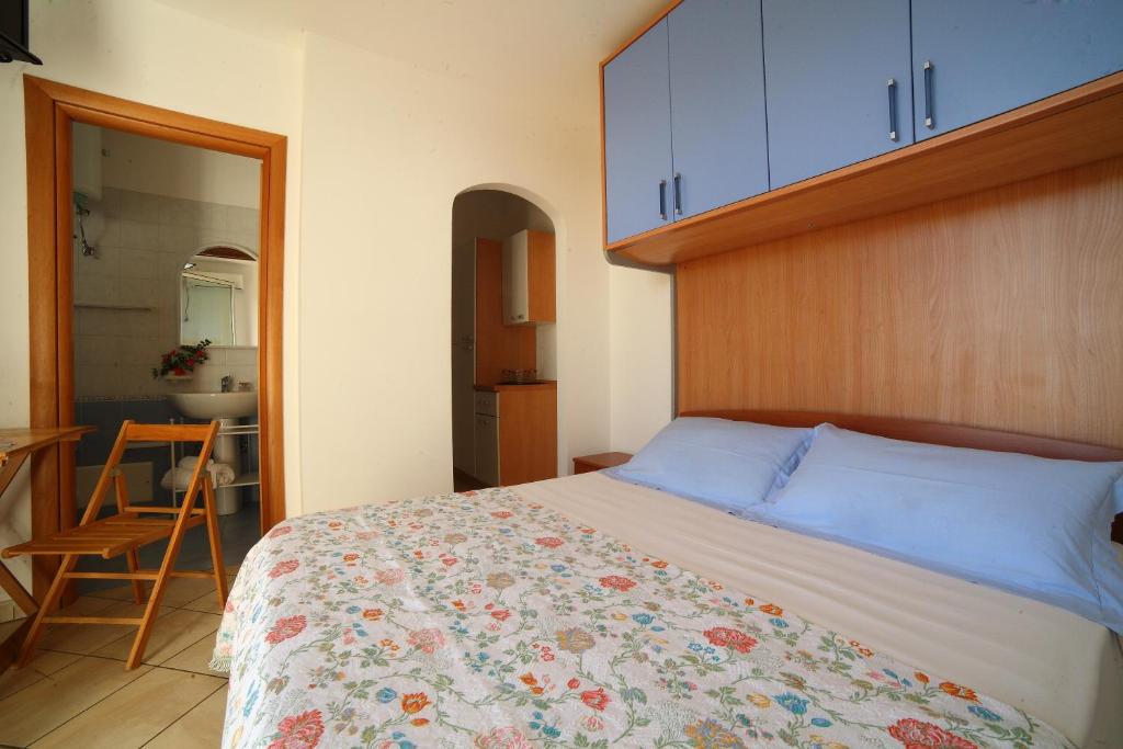 Postel nebo postele na pokoji v ubytování Case vacanza Torre Mozza Ugento Afr0dite
