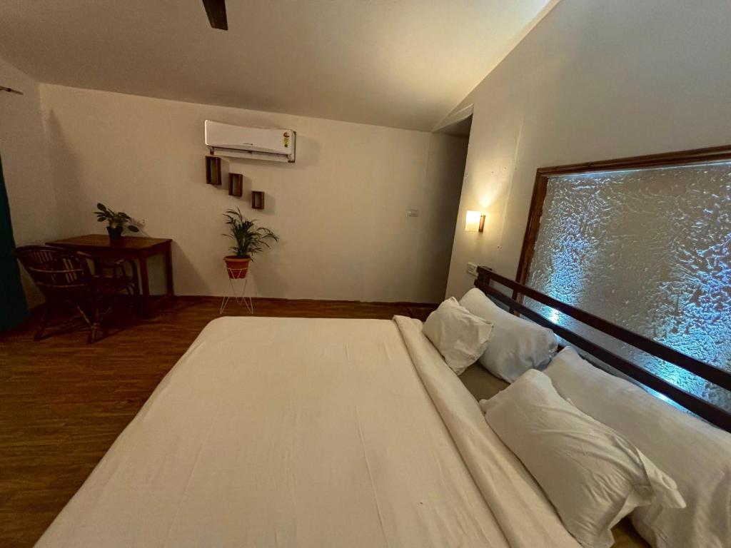 Postel nebo postele na pokoji v ubytování BRAMHA COTTAGES