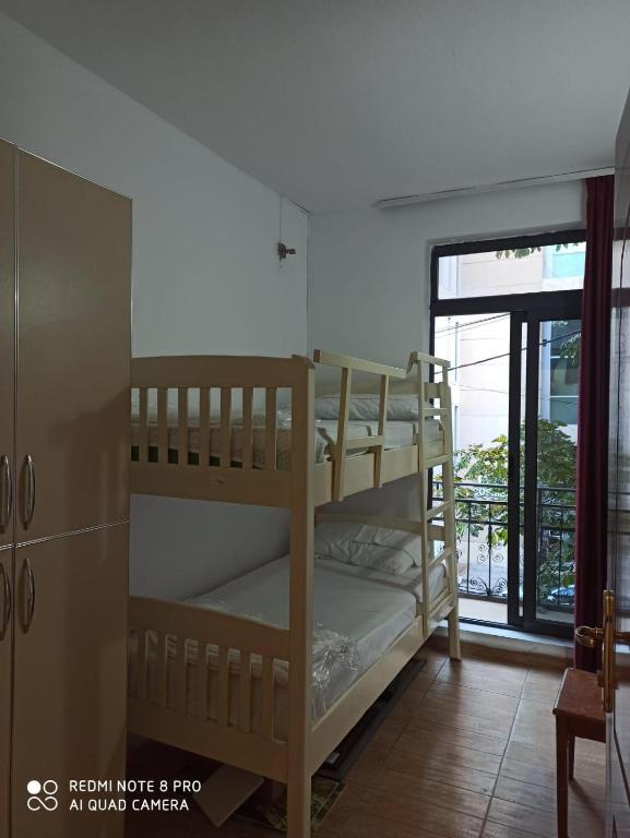 Postel nebo postele na pokoji v ubytování Skanderbeg Square Residences