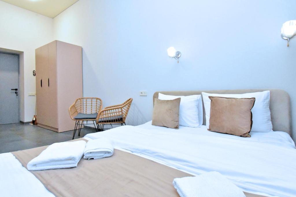 Postel nebo postele na pokoji v ubytování Seva Apart-Hotel Komitas