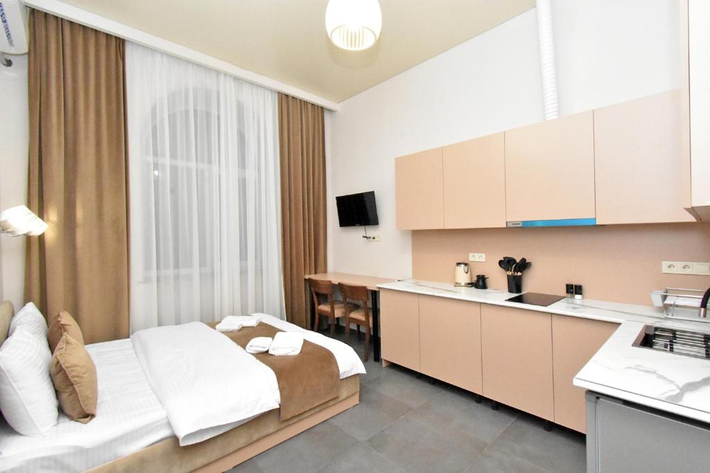 Kuchyň nebo kuchyňský kout v ubytování Seva Apart-Hotel Komitas