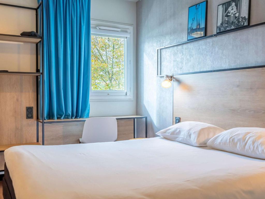 Postel nebo postele na pokoji v ubytování ibis Bayonne Centre