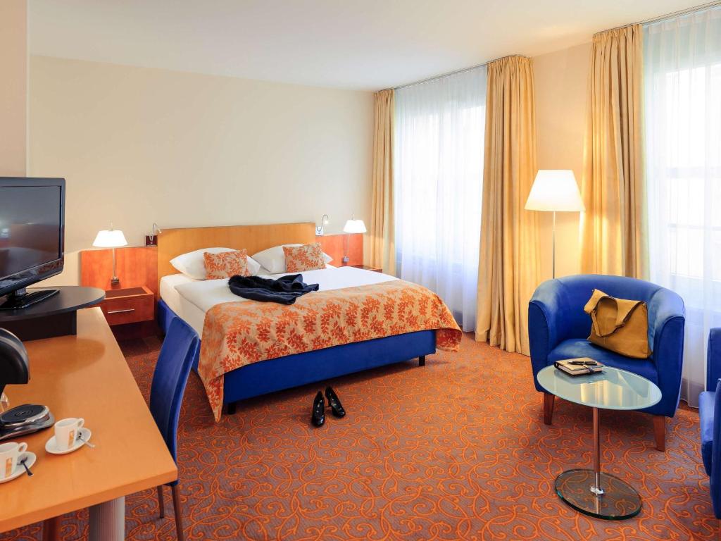 Postel nebo postele na pokoji v ubytování Mercure Hotel & Residenz Berlin Checkpoint Charlie