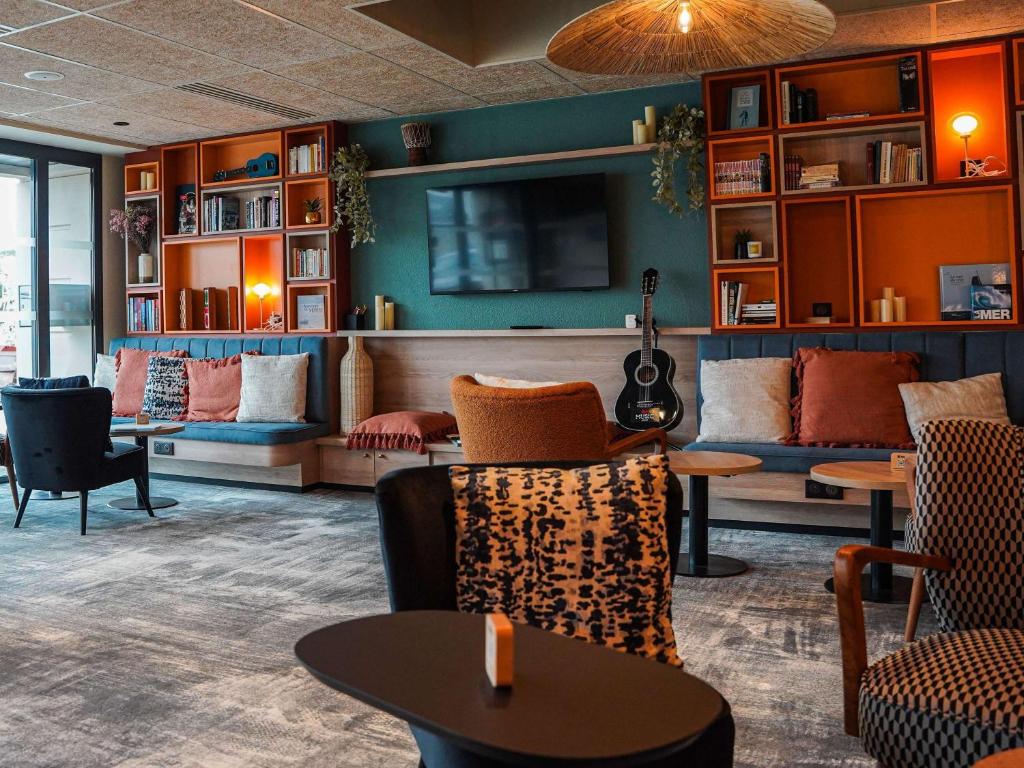 Гостиная зона в ibis Bayeux Port En Bessin