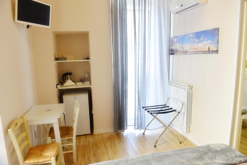 TV a/nebo společenská místnost v ubytování Al Rosa Antico