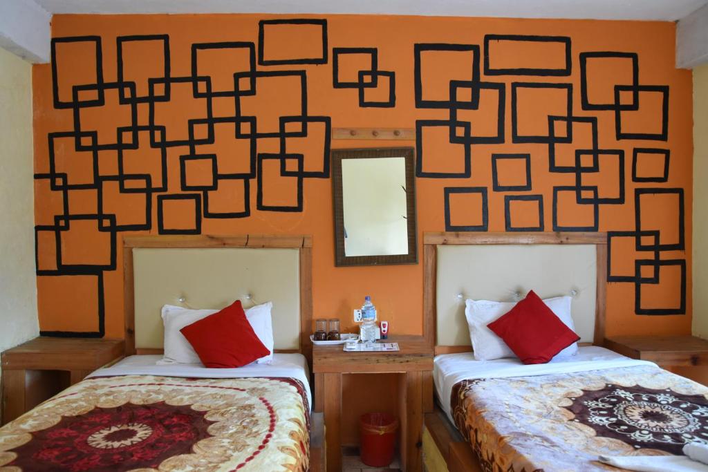 Postel nebo postele na pokoji v ubytování Hong Qi Hotel
