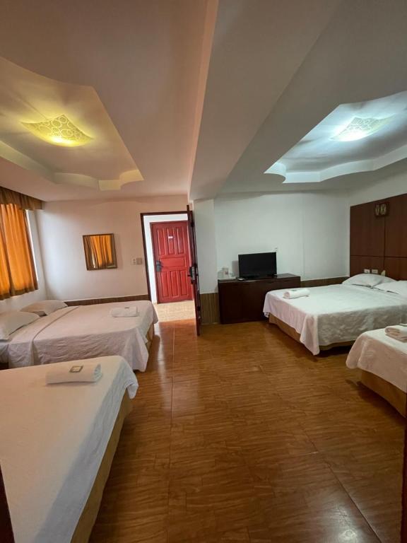 Postel nebo postele na pokoji v ubytování Hotel Costa Inn