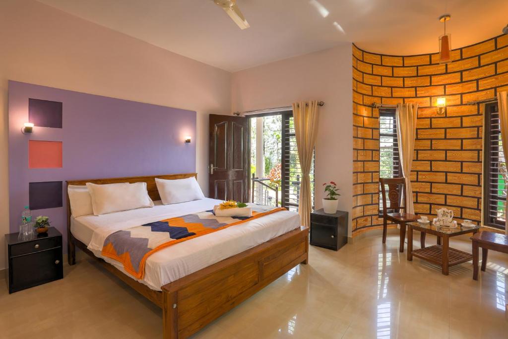 Postel nebo postele na pokoji v ubytování Royal Woods Coorg