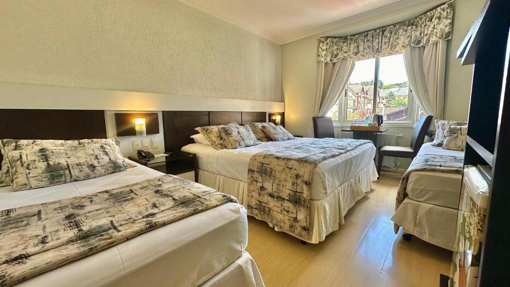 Postel nebo postele na pokoji v ubytování Hotel Glamour da Serra