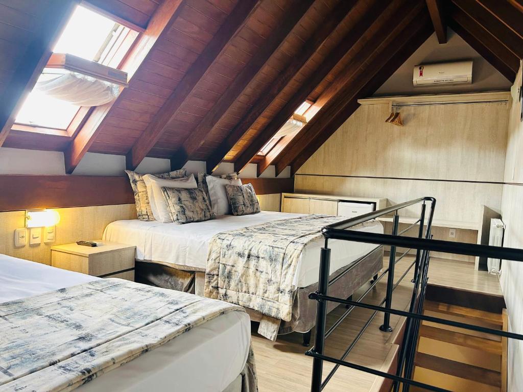 Postel nebo postele na pokoji v ubytování Hotel Glamour da Serra