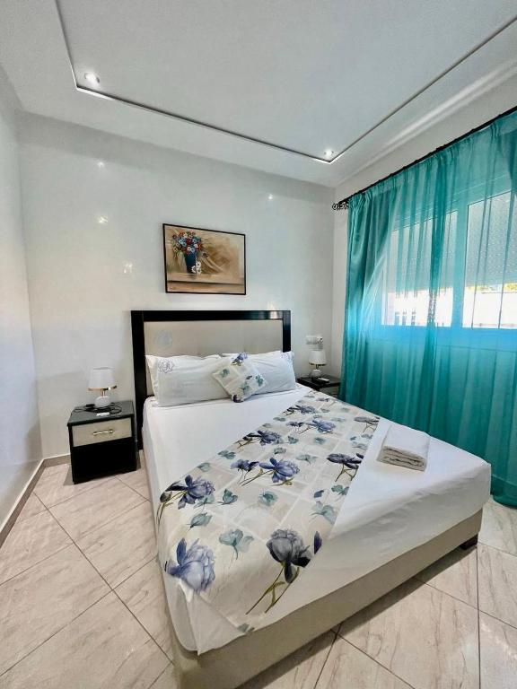 Una cama o camas en una habitación de Appart Hotel Rania