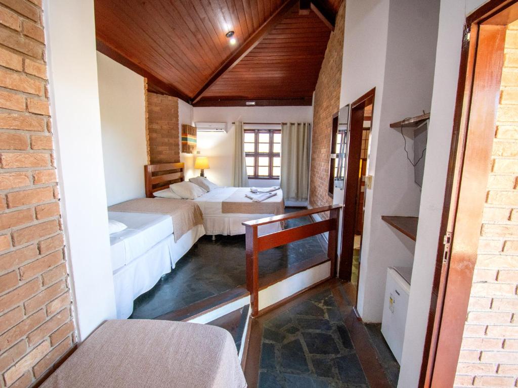 Postel nebo postele na pokoji v ubytování Pousada Arraial Candeia