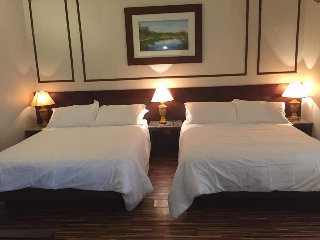 Кровать или кровати в номере D Savoy A Famosa by raisha