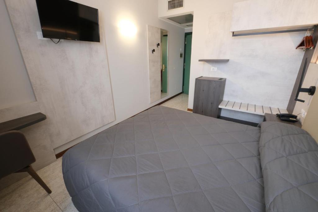 Postel nebo postele na pokoji v ubytování Hotel Mistral