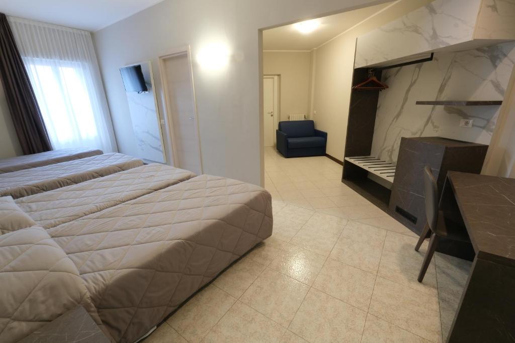 Postel nebo postele na pokoji v ubytování Hotel Mistral