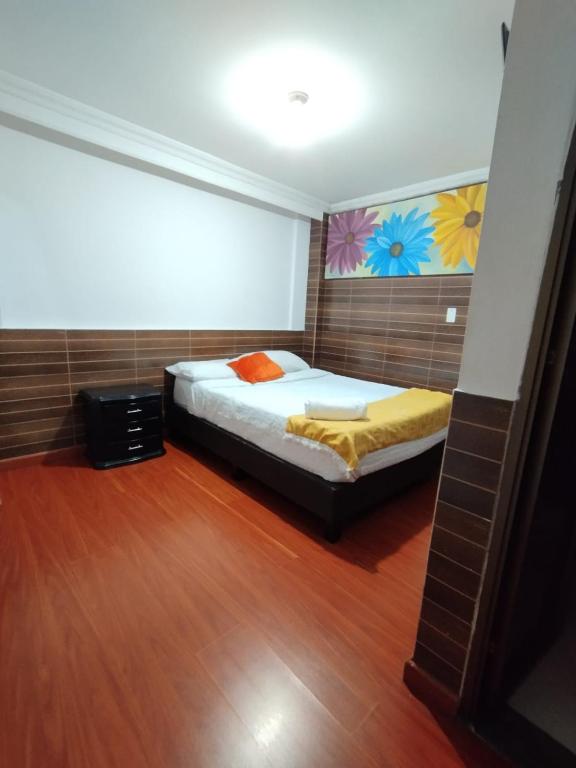 Postel nebo postele na pokoji v ubytování Hotel Ejecutivo 63 In