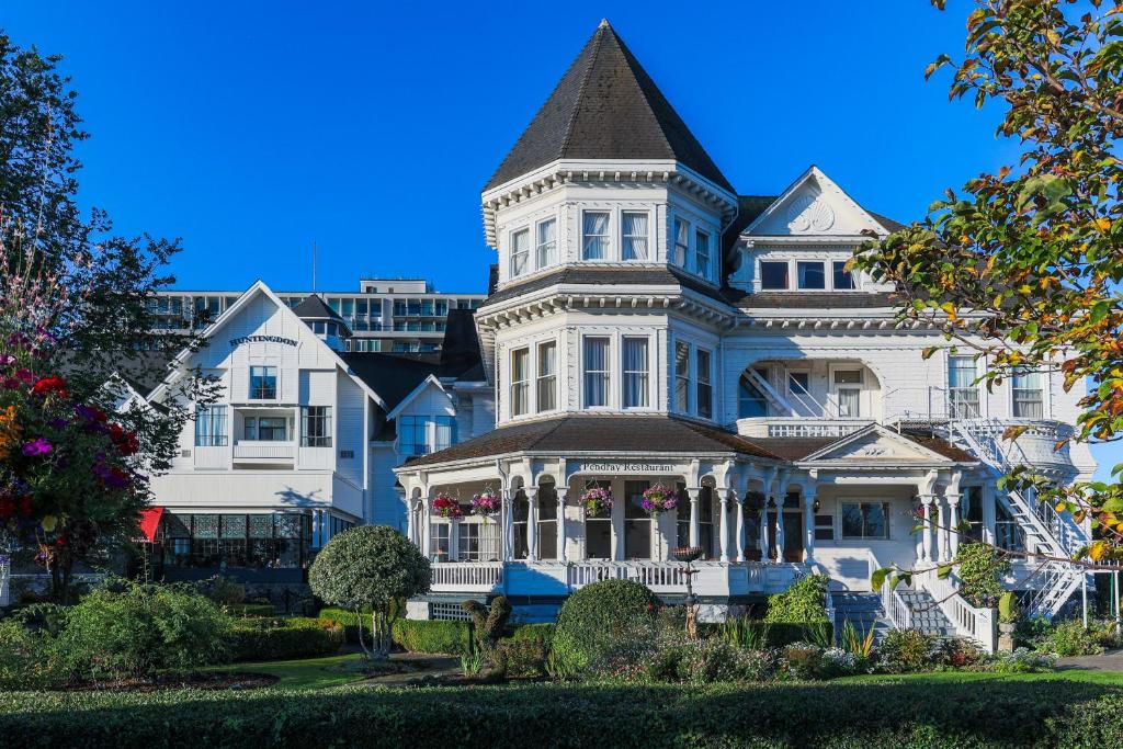 a large white house with a turret at Pendray Inn and Tea House in Victoria