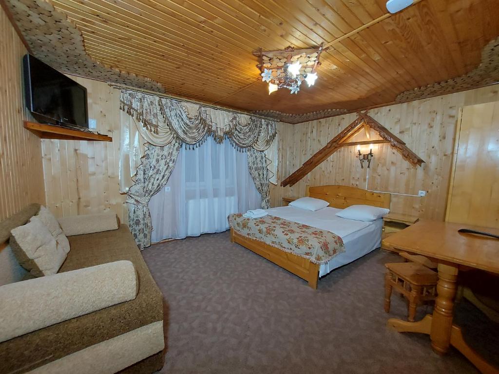 Postel nebo postele na pokoji v ubytování "Як вдома" Буковель