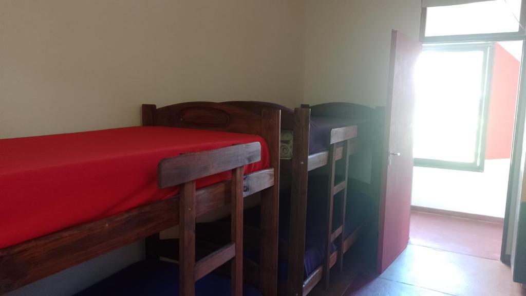 Postel nebo postele na pokoji v ubytování La Brújula Hostel y Club Social