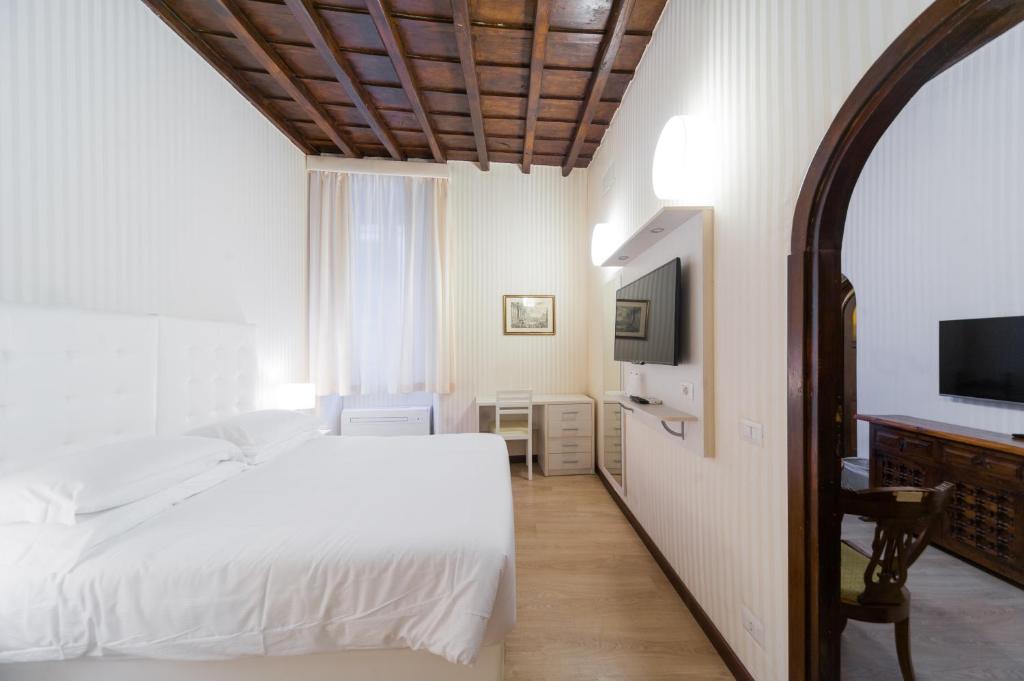 Postel nebo postele na pokoji v ubytování Trevi 41 Hotel
