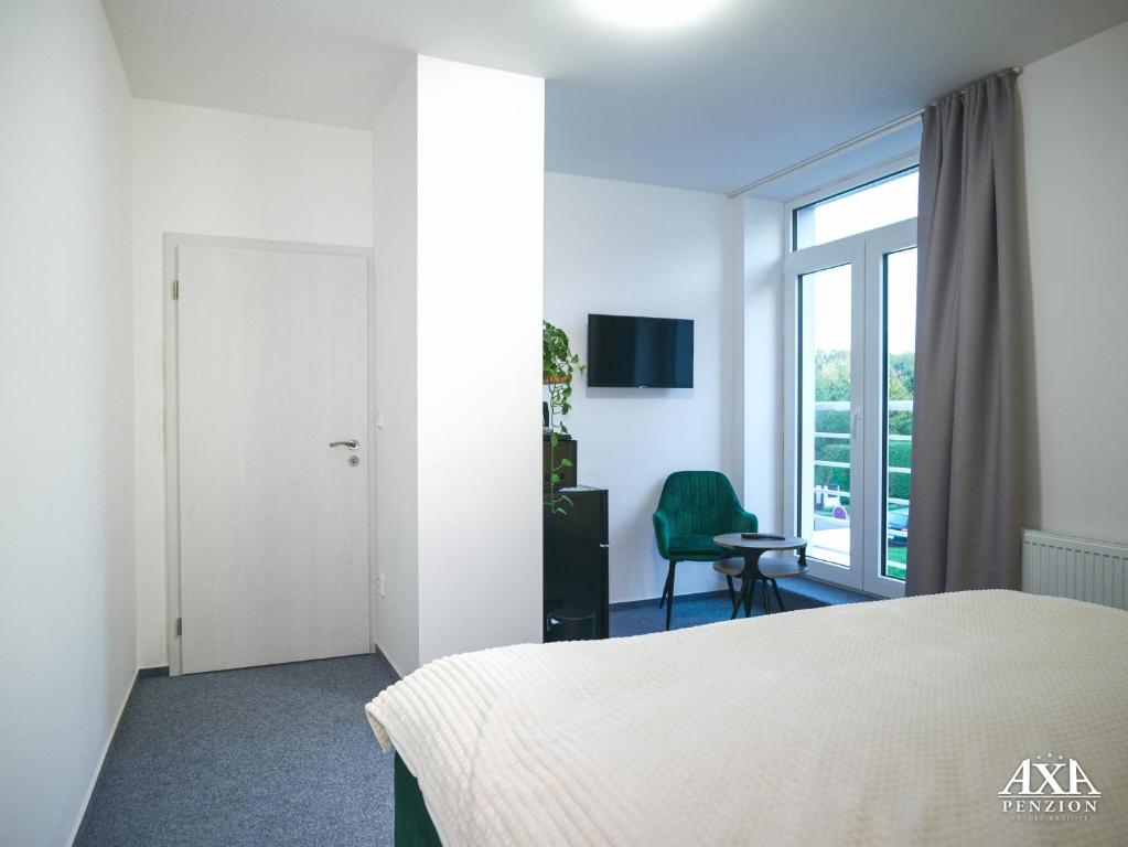 Postel nebo postele na pokoji v ubytování Penzion Axa