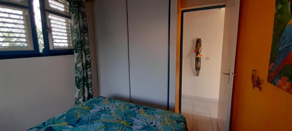 Postel nebo postele na pokoji v ubytování Chambre d'hôte la Calebasse