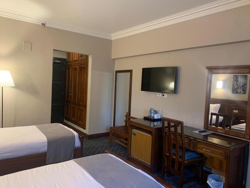 Postel nebo postele na pokoji v ubytování Marwa Palace Hotel Cairo