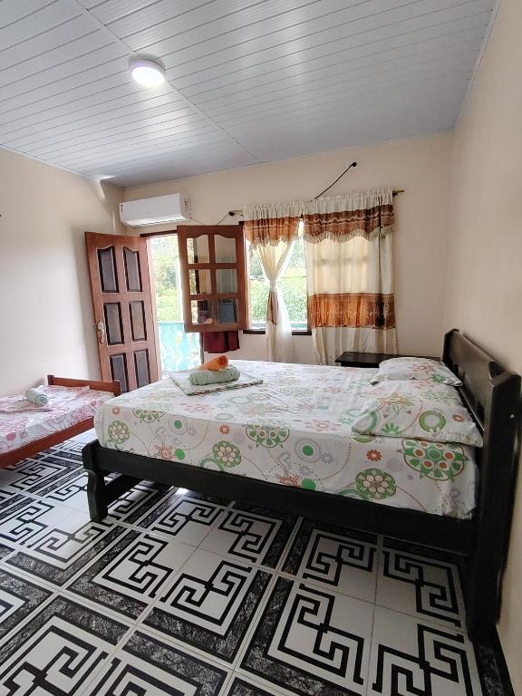 Postel nebo postele na pokoji v ubytování Hotel Alto Amazonas