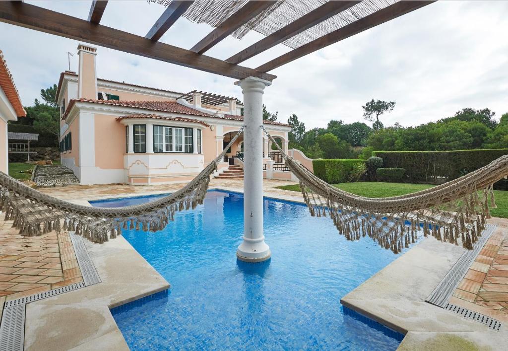 Noble beach villa with private garden and pool