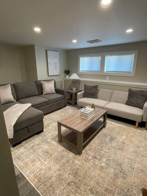 a living room with couches and a coffee table at Perfect Lehigh Valley Oasis in Bethlehem