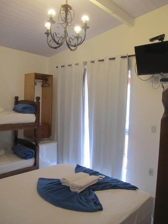 Cama ou camas em um quarto em Hope Pousada