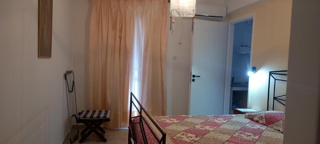 Postel nebo postele na pokoji v ubytování Balcony to Aegeon 1